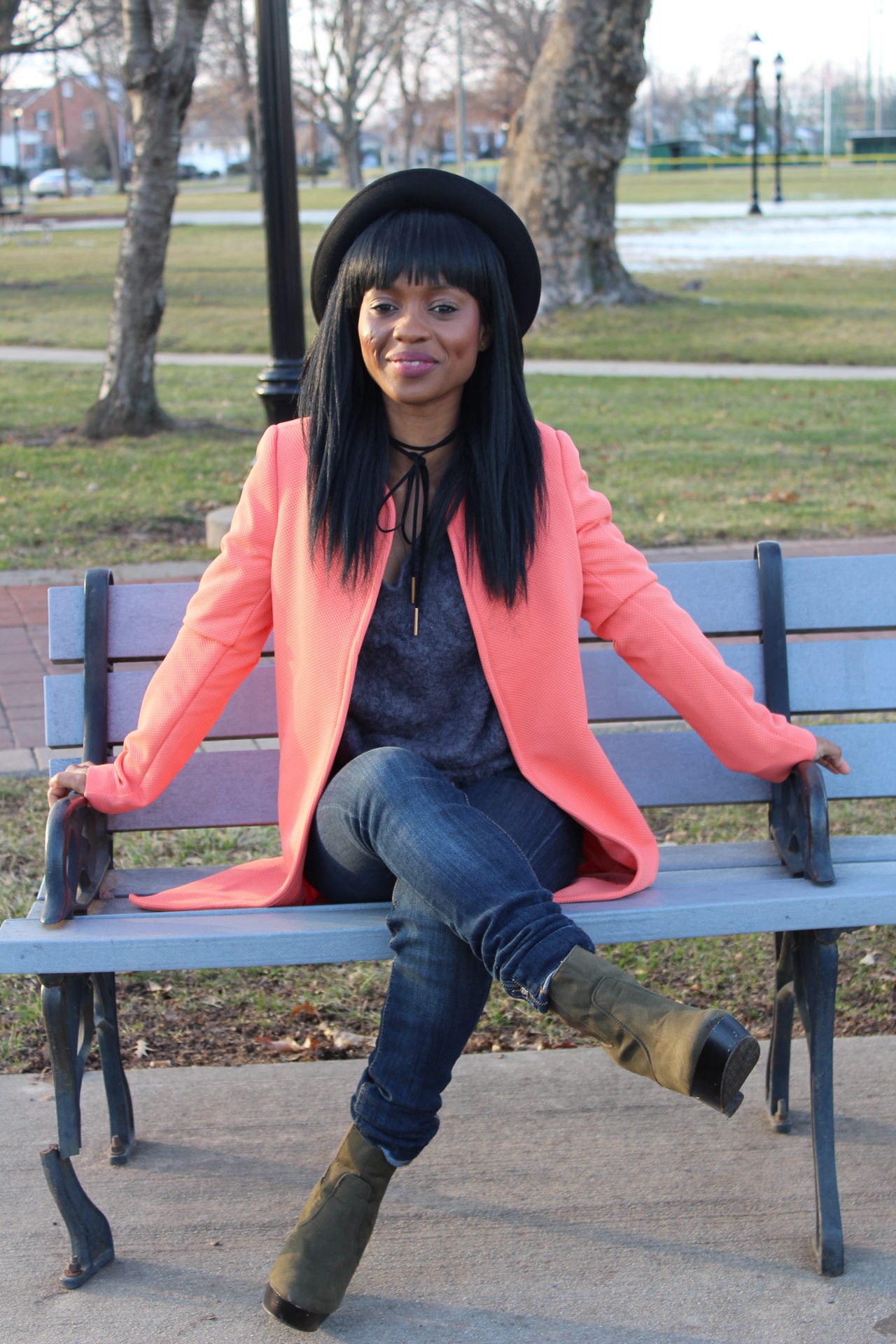 Styl'd Grace Blogger Brittainy Lemelle shares a photo of a woman sitting on a bench
